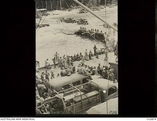 KIRIWINA, TROBRIAND ISLANDS, PAPUA. 1943-11-27. AT THE WHARF AIRMEN FROM NOS. 22 AND 30 SQUADRONS RAAF UNLOADING THEIR OWN GEAR AND CARGO AFTER THE MOVE FROM GOODENOUGH TO KIRIWINA ON BOARD SS ..