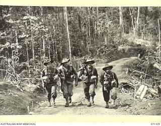 WAREO, NEW GUINEA, 1944-03-20. VX142451 PRIVATE H.A. RUSSELL (1), V124208 PRIVATE J.W. GLASSON (2); VX108999 CORPORAL L.G. MCNEE, MM, (3); AND VX105936 PRIVATE V.A. CHONG, MEMBERS OF THE 29/46TH ..