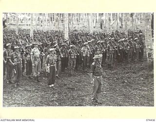 MADANG, NEW GUINEA. 1944-07-01. A JOIN-UP PHOTOGRAPH OF A MORNING PARADE OF THE 24TH INFANTRY BATTALION. TO JOIN TO PHOTOGRAPHS NO. 74435 AND 74437. IDENTIFIED PERSONNEL ARE:- V40880 PRIVATE K.C. ..