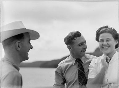 [Portrait of two men and a woman]