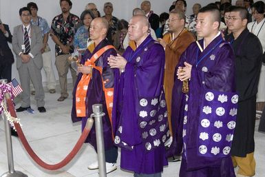 Representatives from the Japan Religious Committee for World Federation, give the"Prayer for Peace"on the USS ARIZONA Memorial at Pearl Harbor, Hawaii, on Dec. 7, 2006. (U.S. Navy PHOTO by Mass Communication SPECIALIST 2nd Class Ben A. Gonzales) (Released)