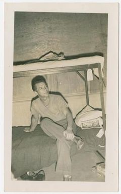 [Robert Reynolds Sitting on a Lower Bunk]