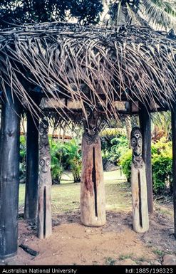 New Caledonia - outdoor shelter with wooden sculptures