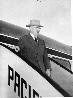 President Harry S. Truman disembarks from the "Independence" at Hickam Field, Hawaii