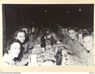 LAE, NEW GUINEA. 1945-10-05. A GENERAL VIEW OF THE FORMAL MESS HELD BY QUEENSLAND AUSTRALIAN ARMY MEDICAL WOMEN'S SERVICE MEMBERS OF 2/7 GENERAL HOSPITAL TO CELEBRATE THE ANNIVERSARY OF THEIR ..