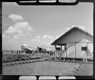 Qantas Empire Airways aircraft on airstrip, Garoka, Papua New Guinea