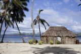 Fiji, thatched-roofed hut on beach of Yasawa Islands