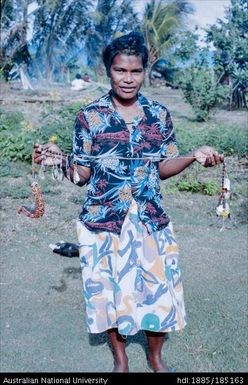 Guasopa: Bosko's wife (?) holding a bagi, given in kula transaction
