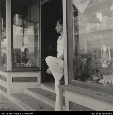 Man standing in the doorway of a shop