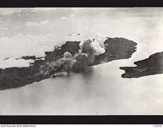 WEWAK, NEW GUINEA. ? 1944-03. LIBERATOR BOMBER AIRCRAFT ATTACKING INSTALLATIONS ON MUSCHU ISLAND, AFTER AN ATTACK ON SHIPPING