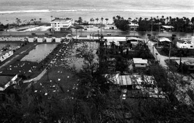An overview of Aniyua, Guam, displaying damage caused by Typhoon Omar, which passed through the area on August 28th