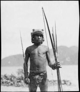 Ramu River man holding a bow and barbed arrows, Ramu River, New Guinea, 1935, 3 / Sarah Chinnery