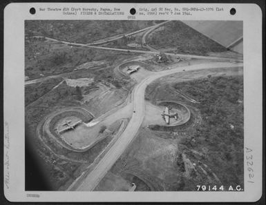 Aerial View Of 7 Mile Strip At Fort Moresby, Papua, New Guinea Showing Revetments For B-17 "Flying Fortress" Planes On The Dispersal Area. April 1943. (U.S. Air Force Number 79144AC)