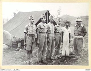 RABAUL, NEW BRITAIN. 1945-09-14. MEMBERS OF 15 PUNJAB REGIMENT, INDIAN ARMY, FORMER PRISONERS OF THE JAPANESE, WITH MAJOR L.F. DARLING, OFFICER COMMANDING RECEPTION, PRISONERS OF WAR, HEADQUARTERS ..