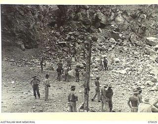 NINE MILE QUARRY AREA, PORT MORESBY, NEW GUINEA. 1944-01-22. THE RESULT AFTER FIRING A 350 LB CHARGE OF GELIGNITE AND MONOBELL BY THE 12TH COMMANDER ROYAL ENGINEERS, (WORKS), (A.I.F.), AT THE NINE ..