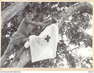 RABAUL AREA, NEW BRITAIN. 1945-09-13. CHINESE CIVILIANS, INTERNED BY THE JAPANESE AT A CAMP 15 MILES WEST OF RABAUL, WERE CONTACTED BY A PARTY OF AUSTRALIAN ARMY AND RED CROSS OFFICIALS SOON AFTER ..