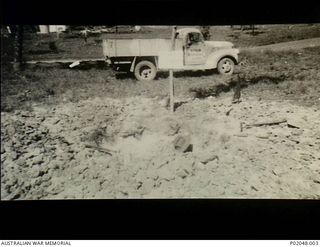Port Moresby, New Guinea. 1942. The truck used by a RAAF Bomb Disposal Unit to transport the unit's equipment and any retrieved bombs. This vehicle had a hinged sign reading "bomb disposal on this ..