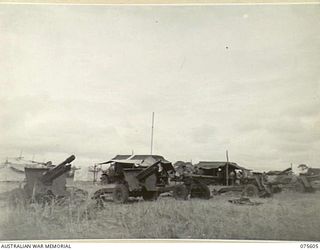 MARKHAM VALLEY, NEW GUINEA. 1944-08-28. 25 POUNDER GUNS OF THE 4TH FIELD REGIMENT, LINED UP FOR CHECKING AN OVERHAUL AT THE 214TH LIGHT AID DETACHMENT WORKSHOPS
