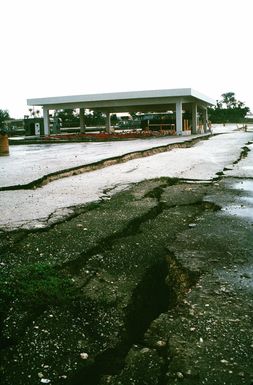 Cracks run through a parking lot in the aftermath of an earthquake that struck the region on August 8th