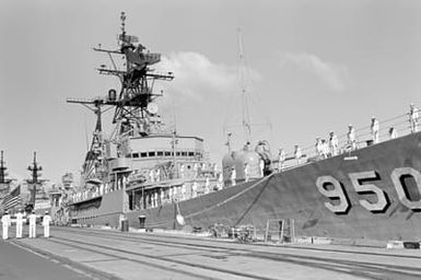Crew members man the rails during the decommissioning of the destroyer USS RICHARD S. EDWARDS (DD 950)