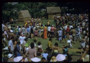 Hawaiian entertainers interacting with tourists