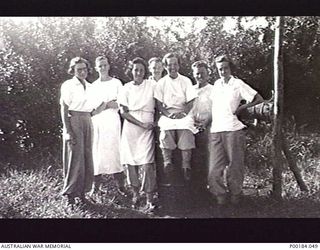 AITAPE. 1945-03. MEMBERS OF THEATRE STAFF; 2/11 AUSTRALIAN GENERAL HOSPITAL. FROM LEFT TO RIGHT: SISTER MCDONALD; JOHNNY GALL; SISTER STEVENSON; UNKNOWN; SISTER FREEMAN; "ERIC"; SISTER SIMSON