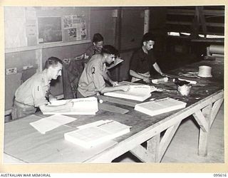 LAE AREA, NEW GUINEA. 1945-08-31. THE DESPATCH SECTION OF THE ARMY NEWSPAPER GUINEA GOLD. PAPERS ARE DESPATCHED BY TRUCK TO PLANES AND BARGES FOR TRANSPORT TO ALL AREAS IN NEW GUINEA, BOUGAINVILLE, ..