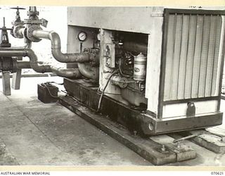 PORT MORESBY, PAPUA, 1944-02-25. UNITED STATES ARMY PUMP HOUSE, REU VALLEY. IT IS ONE OF TWO PUMPING SETS USED BY THE 1ST PETROLEUM STORAGE COMPANY TO PUMP SIX TO EIGHT THOUSAND GALLONS OF AVIATION ..