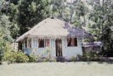 French Polynesia, thatched-roofed cottage on Tahiti Island