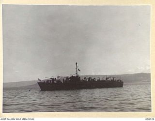 SIMPSON HARBOUR, NEW BRITAIN. 1945-10-13. THE MOTOR LAUNCH 825, ROYAL AUSTRALIAN NAVY, RIDING AT ANCHOR