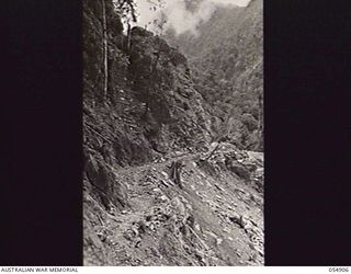 BULLDOG-WAU ROAD, NEW GUINEA, 1943-07-16. UNFINISHED PORTION OF THE ROAD NEAR BANNON'S LOOKOUT