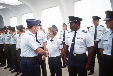 US servicemen and women are congratulated by General (GEN) Jerome O'Malley, commander in chief, US Pacific Forces, at the conclusion of a mass re-enlistment ceremony aboard the USS ARIZONA Memorial