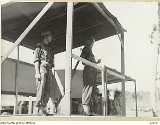 BOUGAINVILLE ISLAND. 1945-01-26. VX38969 MAJOR-GENERAL W. BRIDGEFORD, CBE, MC, GENERAL OFFICER COMMANDING, 3RD DIVISION (2) TAKING THE SALUTE AS TROOPS OF HEADQUARTERS, 15TH INFANTRY BRIGADE PASS ..