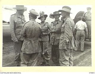 AITAPE, NEW GUINEA. 1945-03-23. LORD WAKEHURST, KCMG, GOVERNOR OF NEW SOUTH WALES (1) IN CONVERSATION WITH VX17 MAJOR- GENERAL J.E.S. STEVENS, DSO, ED (2), AFTER ARRIVING AT TADJI AIRSTRIP. ..