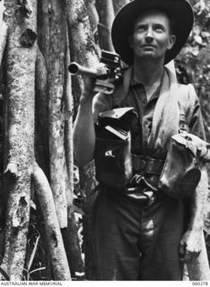 GUY'S POST, FARIA RIVER AREA, NEW GUINEA. 1943-11-08. NX20608 PRIVATE G. MYERS OF BONDI, NSW, AND OF THE 2/33RD AUSTRALIAN INFANTRY BATTALION MOVING TO GUY'S POST TO RELIEVE MEMBERS OF THE 21ST ..