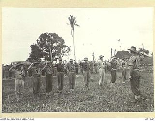 HELDSBACH MISSION, FINSCHHAFEN, NEW GUINEA. 1944-03-27. OFFICERS OF THE 2/3RD CASUALTY CLEARING STATION BEING DISMISSED BY THE COMMANDING OFFICER, NX109 LIEUTENANT COLONEL R. BECKE (1), AT THE ..