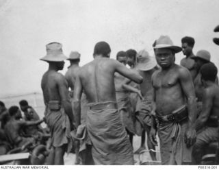 RABAUL, NEW BRITAIN, 12/9/1914. A GROUP OF NATIVE PRISONERS WHO WERE DETAINED ON BOARD HMAS SYDNEY UNTIL FIGHTING HAD CEASED, DURING THE CAPTURE OF RABAUL FROM THE GERMANS BY THE AUSTRALIAN NAVY ..