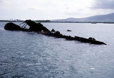 A view of the wreck of the former battleship/target ship USS UTAH (BB-31, AG-16), which was sunk at its moorings on the west side of Ford Island on December 7, 1941, during the Japanese attack on Pearl Harbor