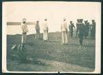 Inspection of the Guard, from left to right: [Don] Waugh, C Bates (helmet only showing), the Administrator [of the Mandated Territory of New Guinea Evan Alexander Wisdom] (furthest away), [Teddy] Meares (official secretary) and Ball (Assistant District In