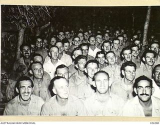 PAPUA. 1942-08-19. SECTION OF THE AUDIENCE AT A COMMUNITY SINGING CONCERT HELD AT PORT MORESBY BY NO.4 FIGHTER SECTION RAAF