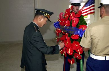 General Cho, Yung Kil (Left), Chairman, Joint Chiefs of STAFF, Republic of Korea, puts a wreath in place during a ceremony at the USS Arizona Memorial at Pearl Harbor, Hawaii, on October 30th, 2000. The ceremony honored the 1,177 Sailors and Marines who lost their lives during the 1941 attack on Pearl Harbor. GEN Cho is in Hawaii this week attending the Chiefs of Defense Conference