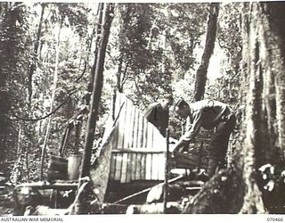 PROTHERO 2 AREA, FARIA RIVER, NEW GUINEA, 1944-02-16. VX81103 MAJOR W. MCCALL (1) THE OFFICER COMMANDING "A" COMPANY, 57/60TH INFANTRY BATTALION, VX3964 CAPTAIN F. CLARK (2), THE SECOND IN CHARGE, ..