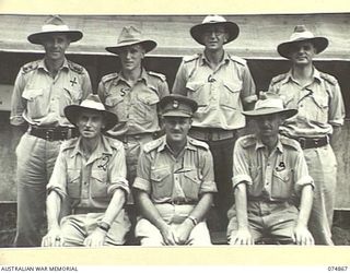 LAE-NADZAB, NEW GUINEA. 1944-07-20. THE CHIEF ENGINEER AND HIS OFFICERS OUTSIDE THEIR OFFICE AT HEADQUARTERS, NEW GUINEA. FORCE. IDENTIFIED PERSONNEL ARE:- VX250 BRIGADIER A.G. TORR, DSO, CHIEF ..