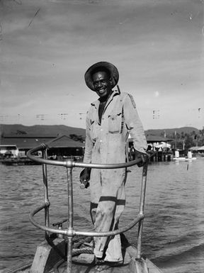 [Man possibly standing on the prow of a boat]