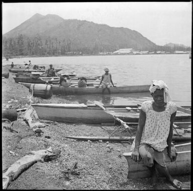 Row of empty canoes on the shore at Rabaul, New Guinea, ca. 1929 / Sarah Chinnery
