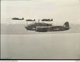 WEWAK AREA, NORTH NEW GUINEA. 1945-01-20. FOUR BEAUFORT BOMBER AIRCRAFT OF NO. 100 SQUADRON RAAF IN FLIGHT HEAD FOR WEWAK TO DESTROY JAPANESE FUEL AND AMMUNITION DUMPS. AIRCRAFT IN THE FOREGROUND ..