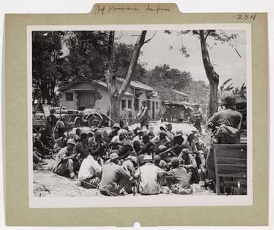 Photograph of a Group of Japanese Prisoners Guarded by American Military Police