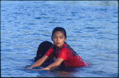 Two children playing in water