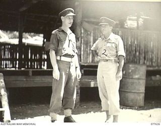 KAMALGAMAN ANCHORAGE, JACQUINOT BAY, NEW BRITAIN. 1944-12-23. PX170 MAJOR A.A. ROBERTS, DISTRICT OFFICER AUSTRALIAN NEW GUINEA ADMINISTRATIVE UNIT (ANGAU) (1) WITH VX27 MAJOR-GENERAL A.H. RAMSAY, ..