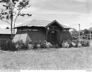LAE BASE AREA, NEW GUINEA. 1944-12-01. THE HUT OF THE OFFICER- IN- CHARGE, BUILT AS A SURPRISE BY MEMBERS OF THE 22ND WORKS COMPANY WHILE HE WAS AWAY ON AN INSPECTION TOUR OF OTHER DETACHMENTS OF ..